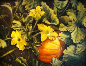 A ripe pumpkin surrounded by large green leaves and yellow flowers.