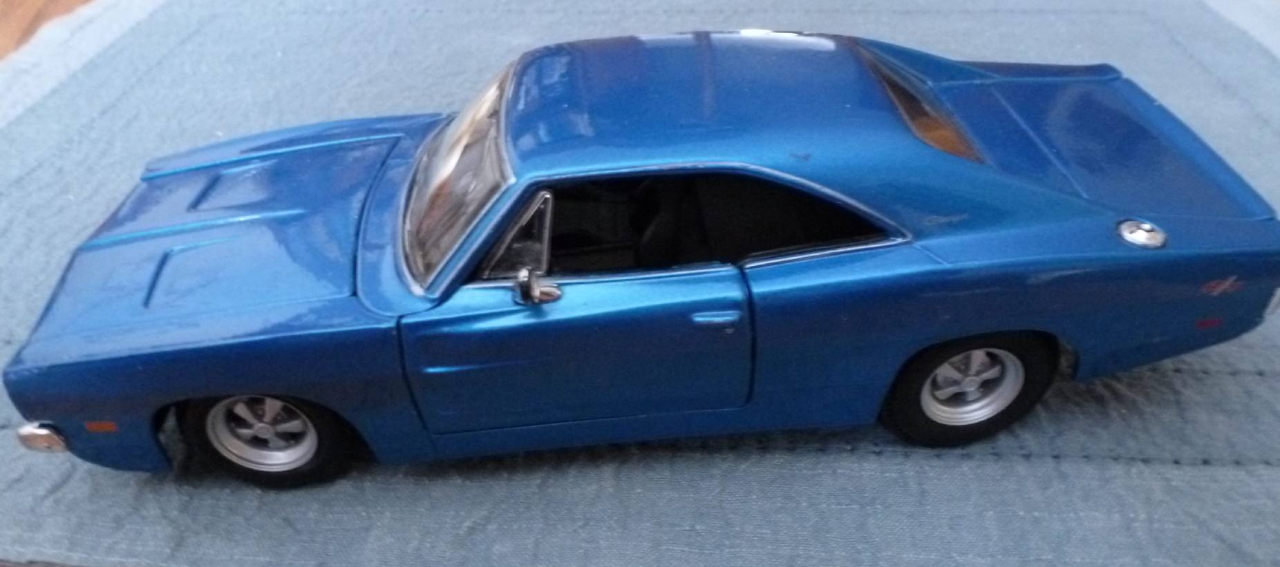 Classic blue muscle car with a sleek design.