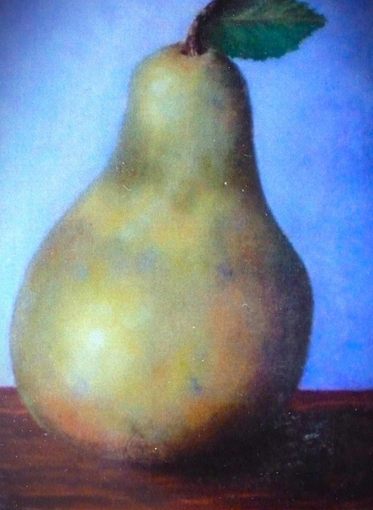 A pear against a blue background.